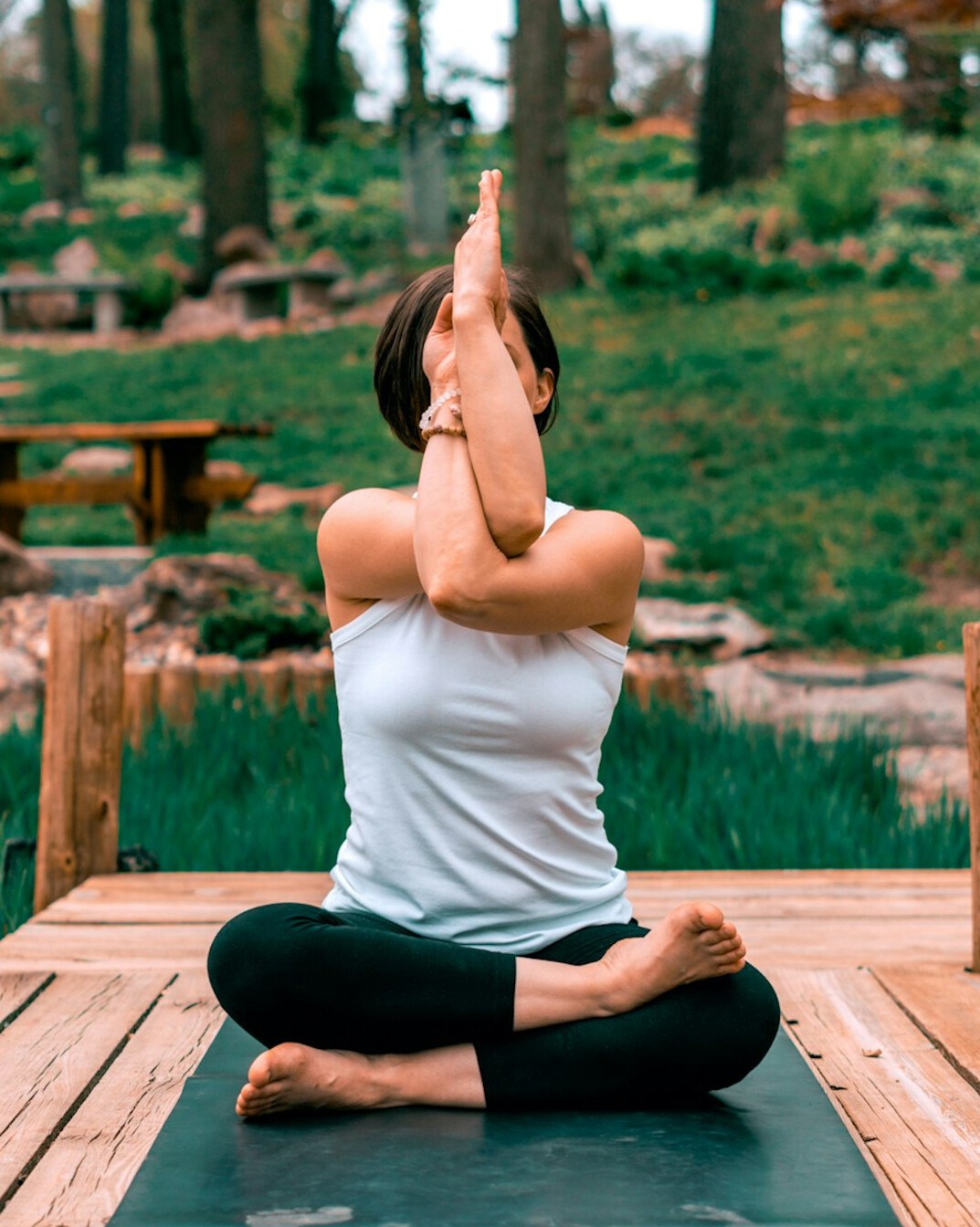 person meditating outdoors